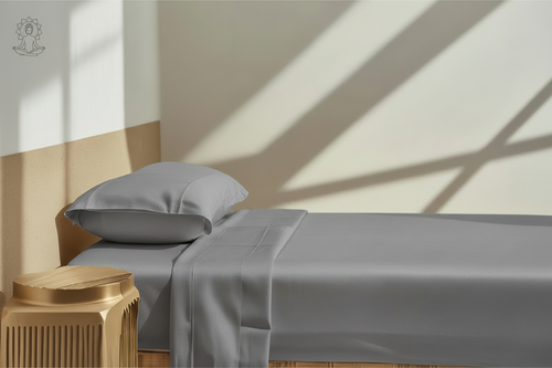 Bed with white bedding and pillows in a softly lit room